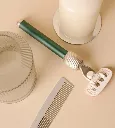 fler_green_pine_razor_laying_on_the_table.webp